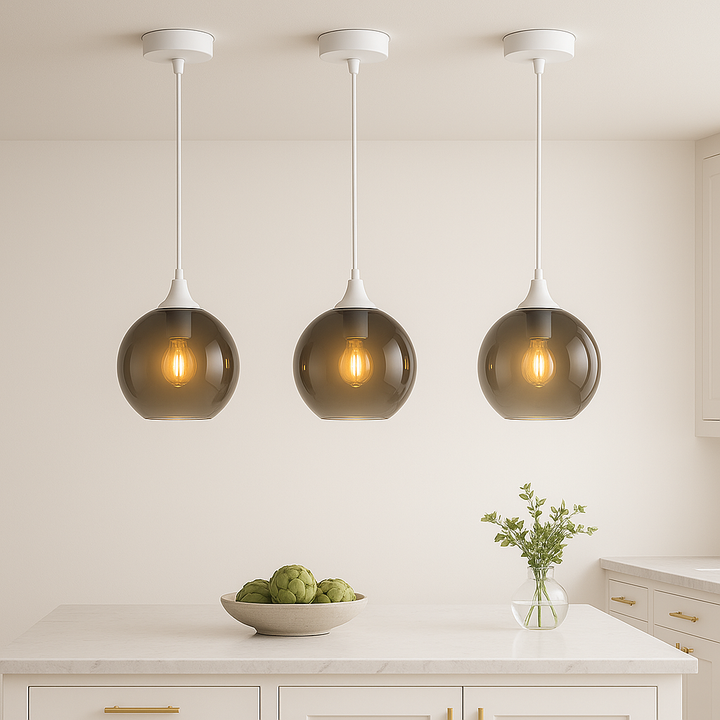 Three Irvine white smoked glass pendants above white kitchen island 3000k