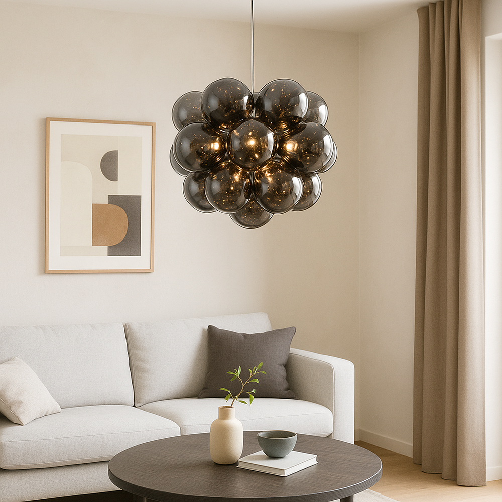 Loxton large black bubble glass pendant light hanging in a modern living room above a round coffee table with neutral sofa and abstract artwork