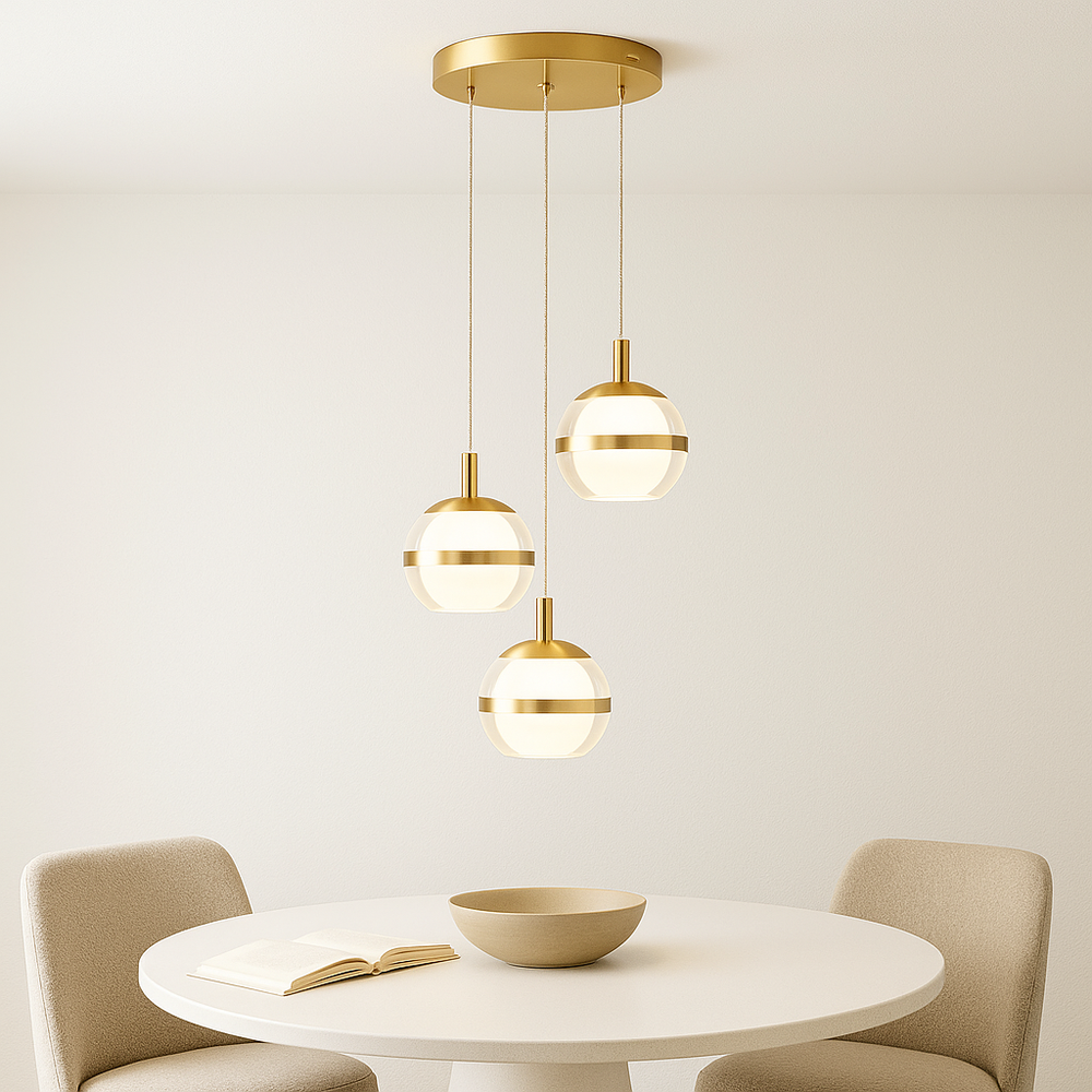 Gold 3-light pendant above round dining table