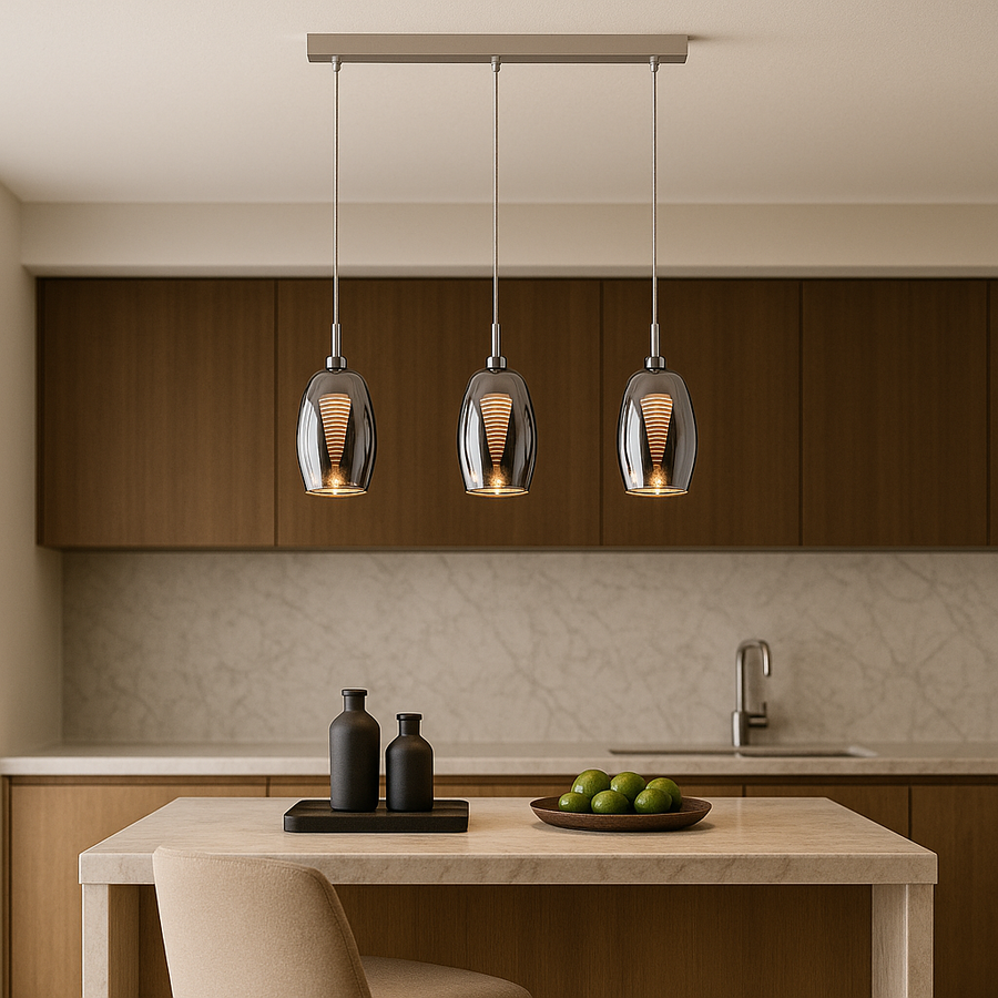 Luxury modern kitchen with a marble island and three smoked glass pendant bar lights in proportion, hanging from a ceiling with warm neutral tones