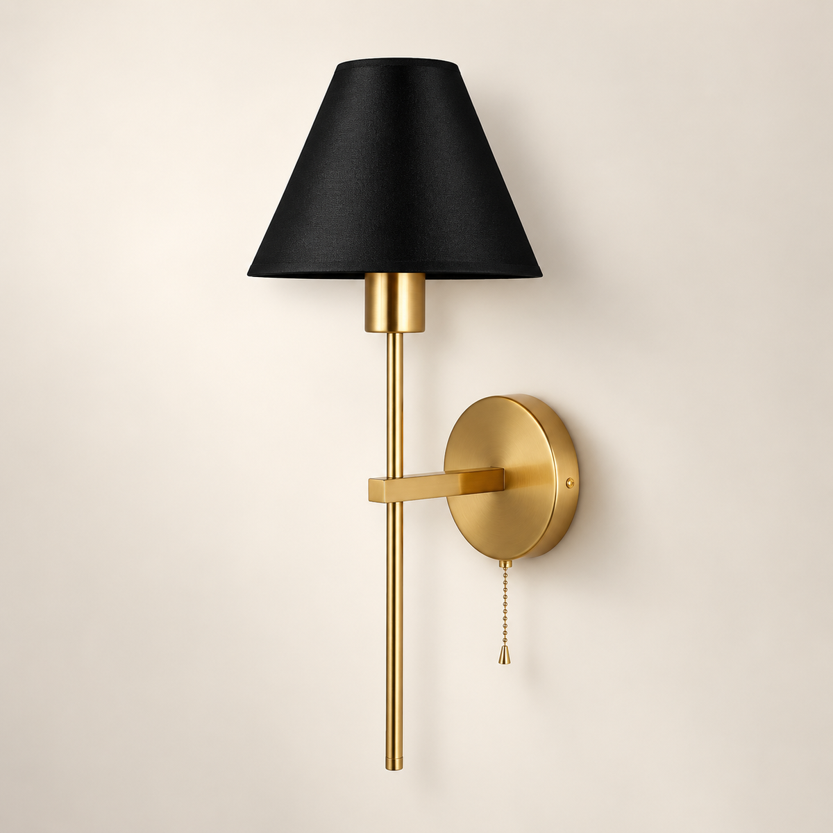 Mahon brass wall light with black fabric shade and pull cord switch.