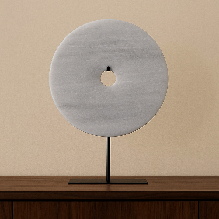 light grey marble disc sculpture