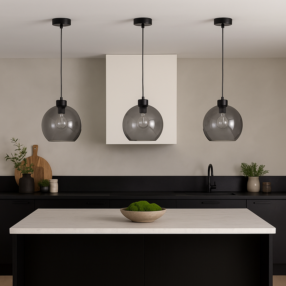 Modern kitchen with three 25cm smoked glass pendant lights featuring clear bulbs hanging above an island with green moss bowl