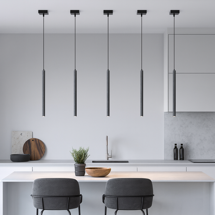 Modern kitchen with five slim concrete pendant lights over island