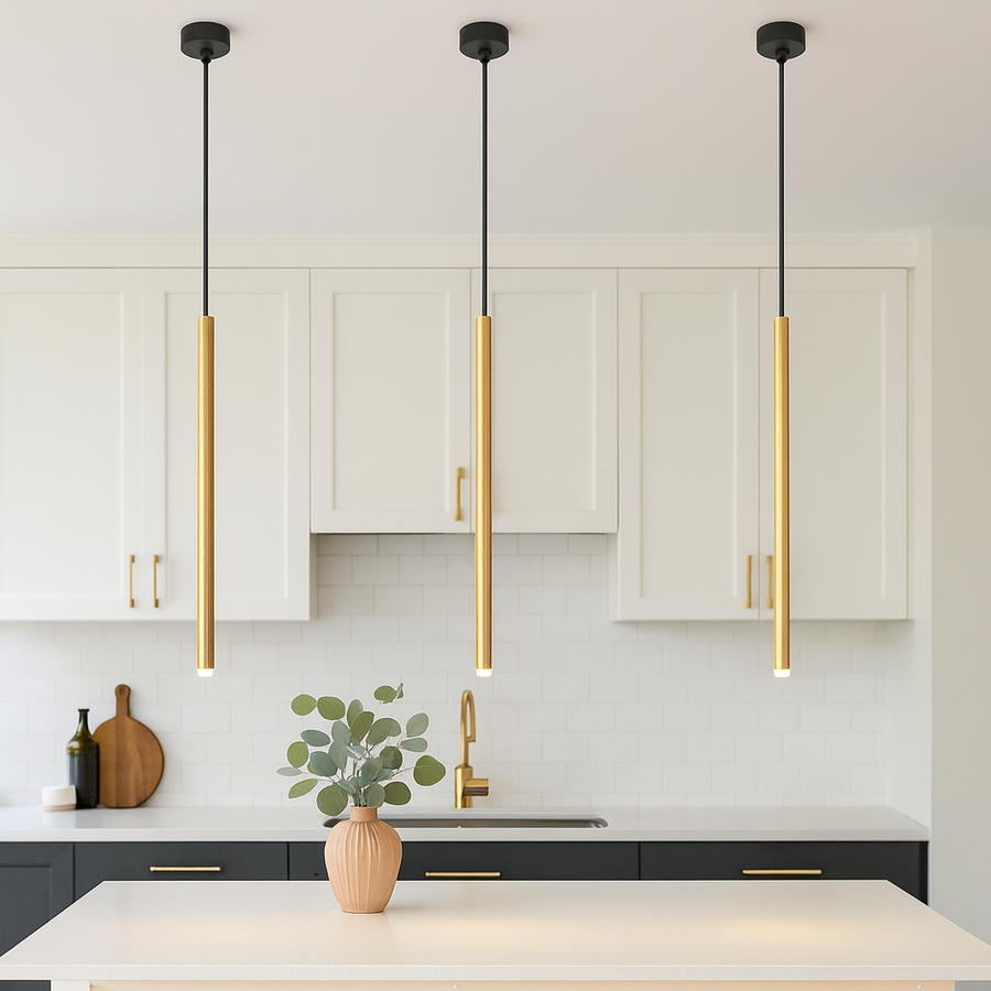 Modern white kitchen with gold accents featuring three slim 2.5cm wide gold pendant lights hanging proportionally over a small island