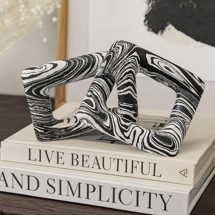 Black and white chain sculpture with marbled finish, modern décor accessory