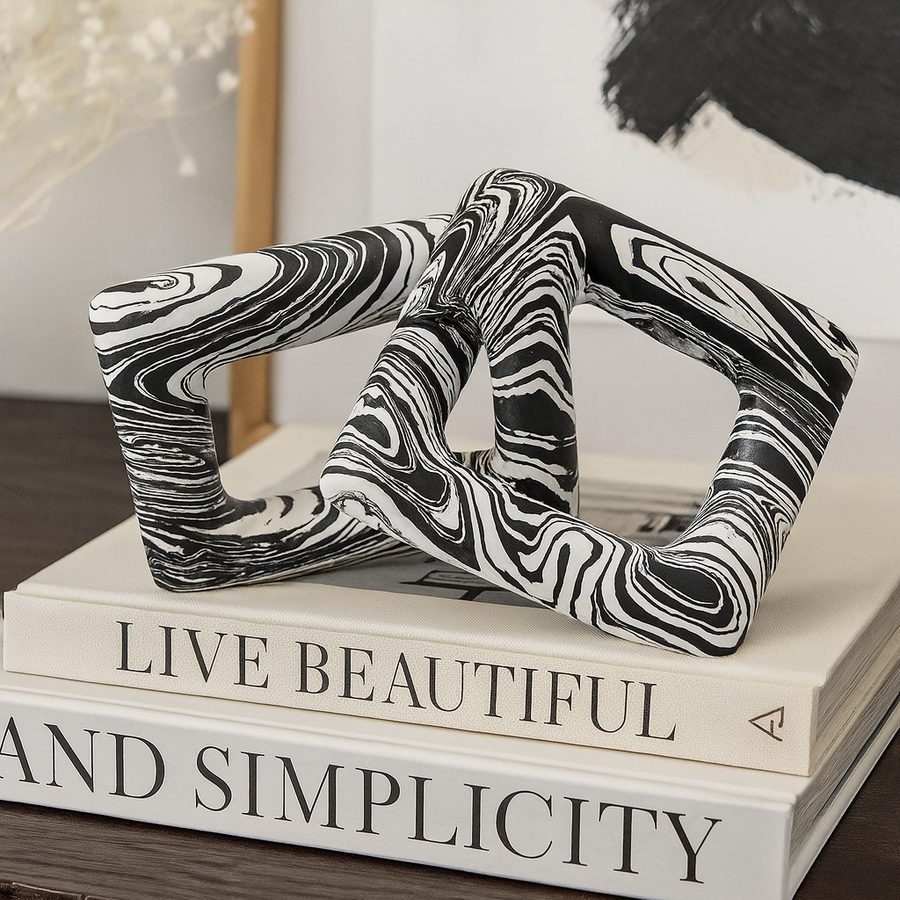 Black and white chain sculpture with marbled finish, modern décor accessory