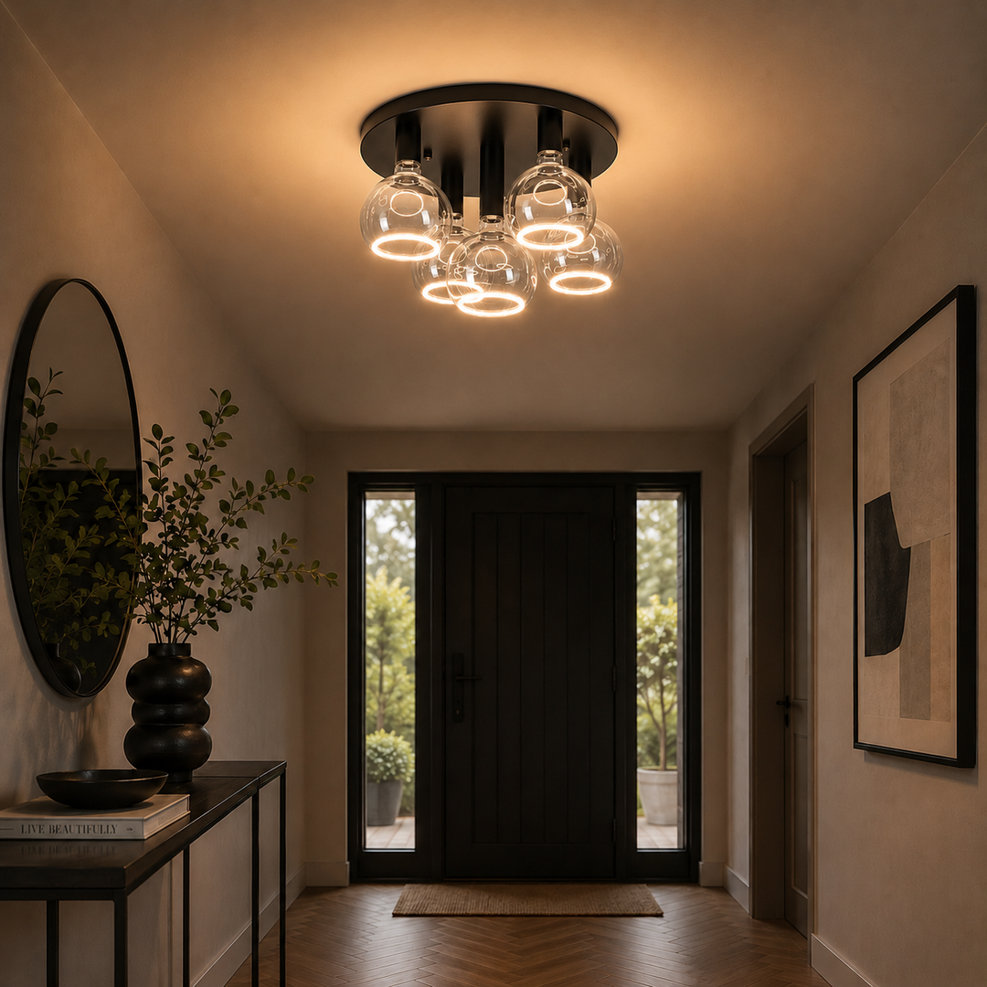 Roma 5 light flush ceiling light with an all black frame and clear glass ring bulbs in a luxury modern hallway setting.