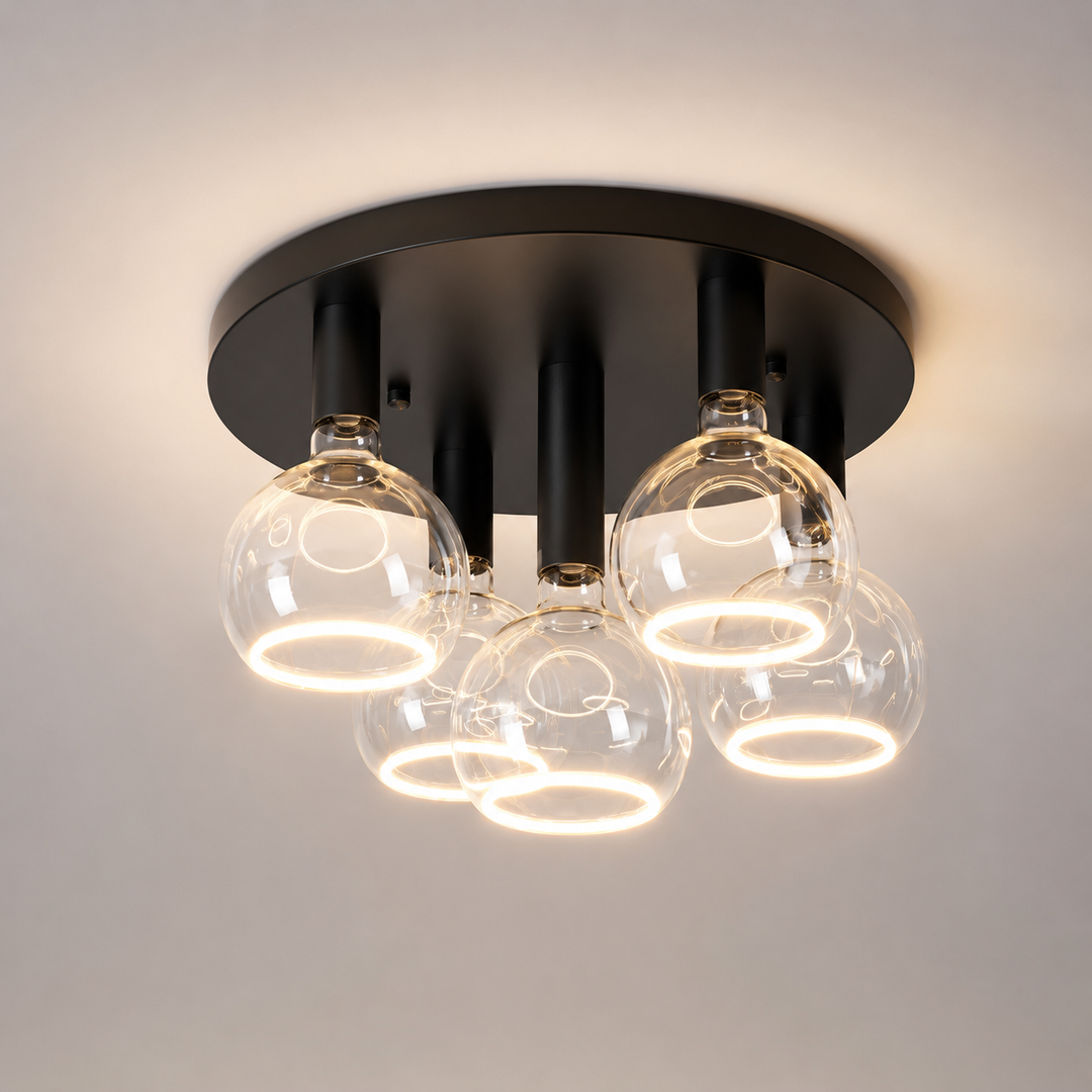 Roma 5 light flush ceiling light with an all black frame and clear glass ring bulbs in a luxury square hero image.