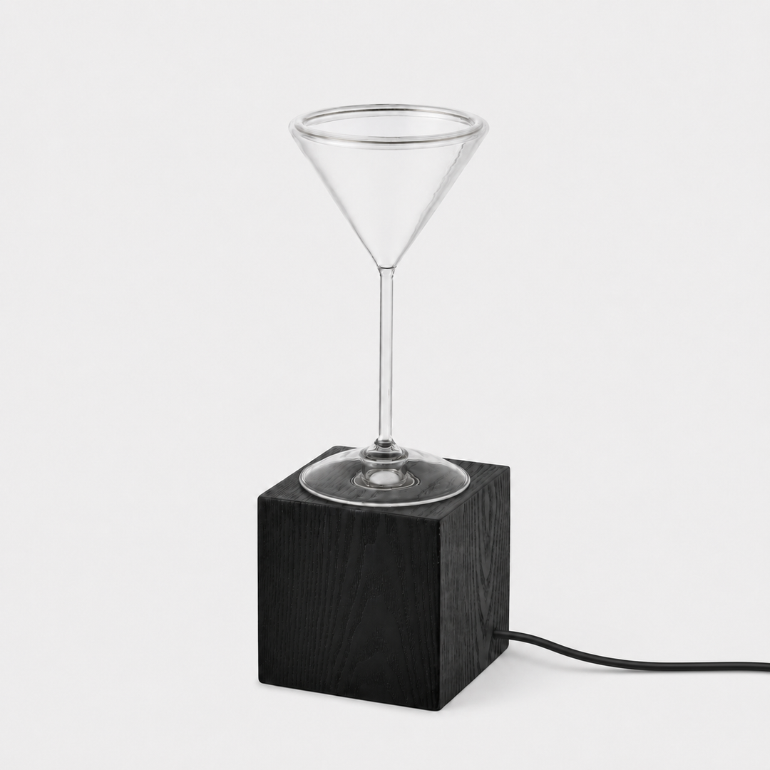 Roma Cocktail Glass Aura Ring table lamp with clear cocktail glass bulb, black wood block base and black power cable, shown unlit.