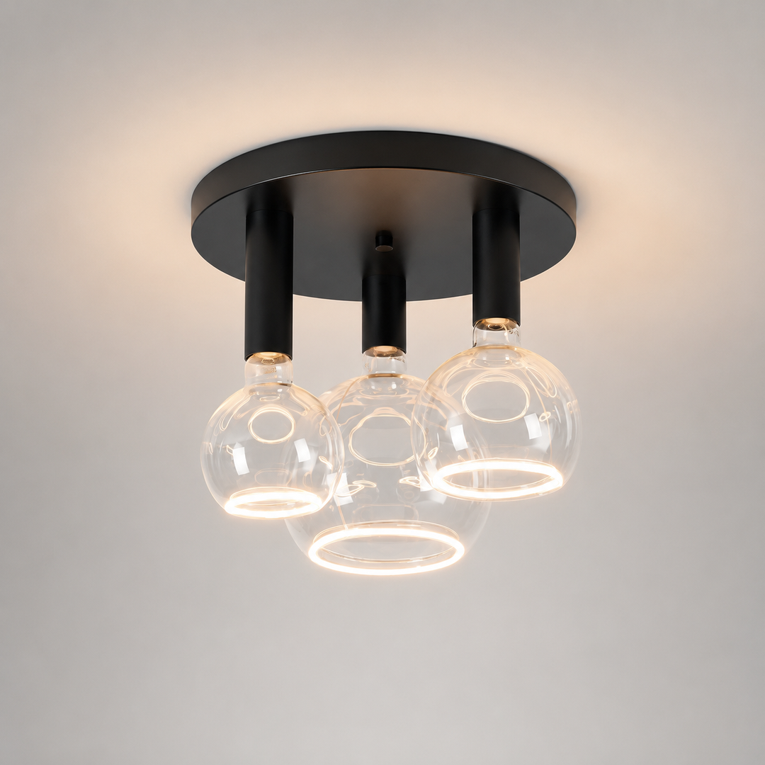 Roma small 3 light flush ceiling light with all black frame and clear Roma Aura bulbs in a luxury square hero image.