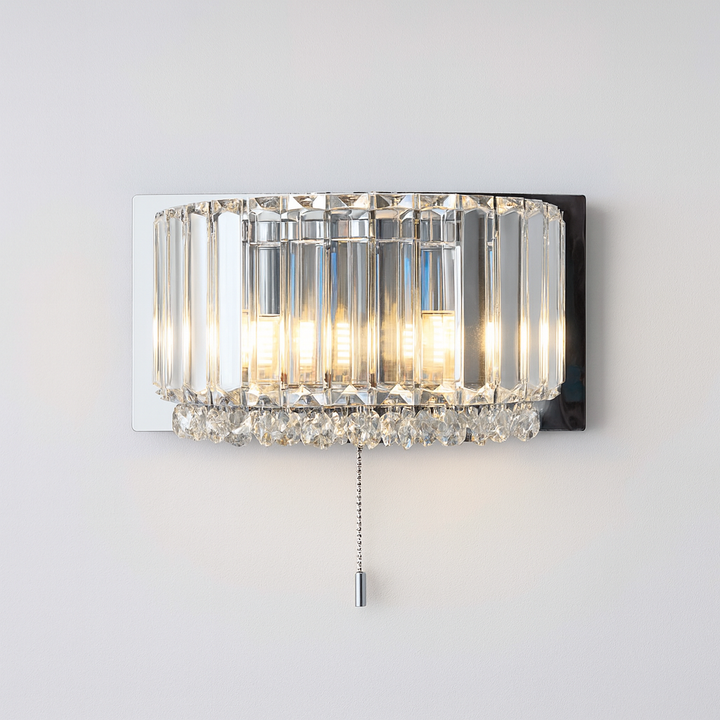 Luxury Salzburg crystal wall light in chrome with faceted prisms and crystal droplets, 26cm wide x 15cm high, switched with pull chain.