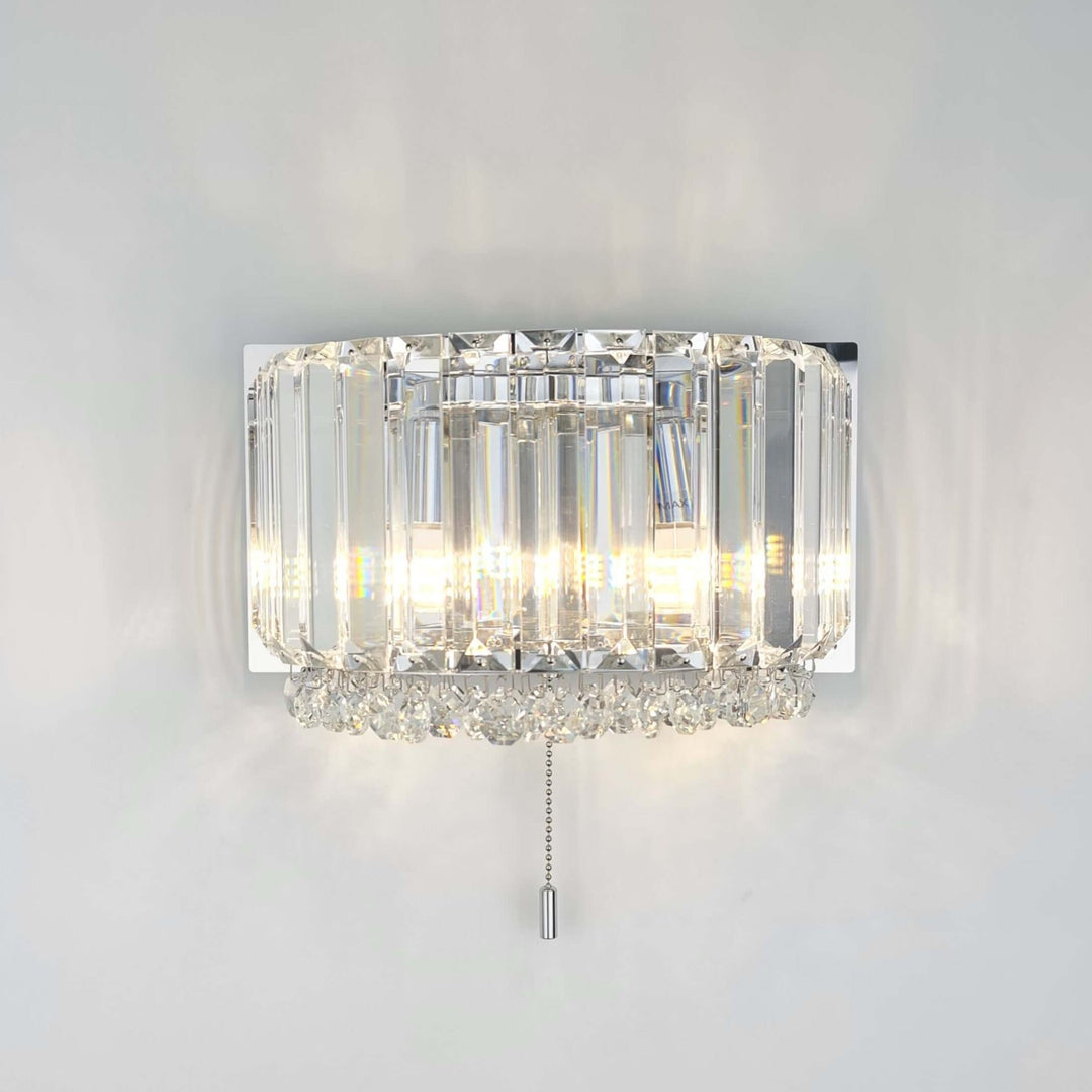 Salzburg rounded wall light in polished chrome with K9 crystal blocks and buttons, modern luxury wall sconce.
