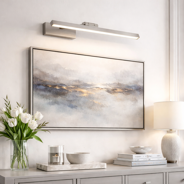 Silver LED picture light over artwork