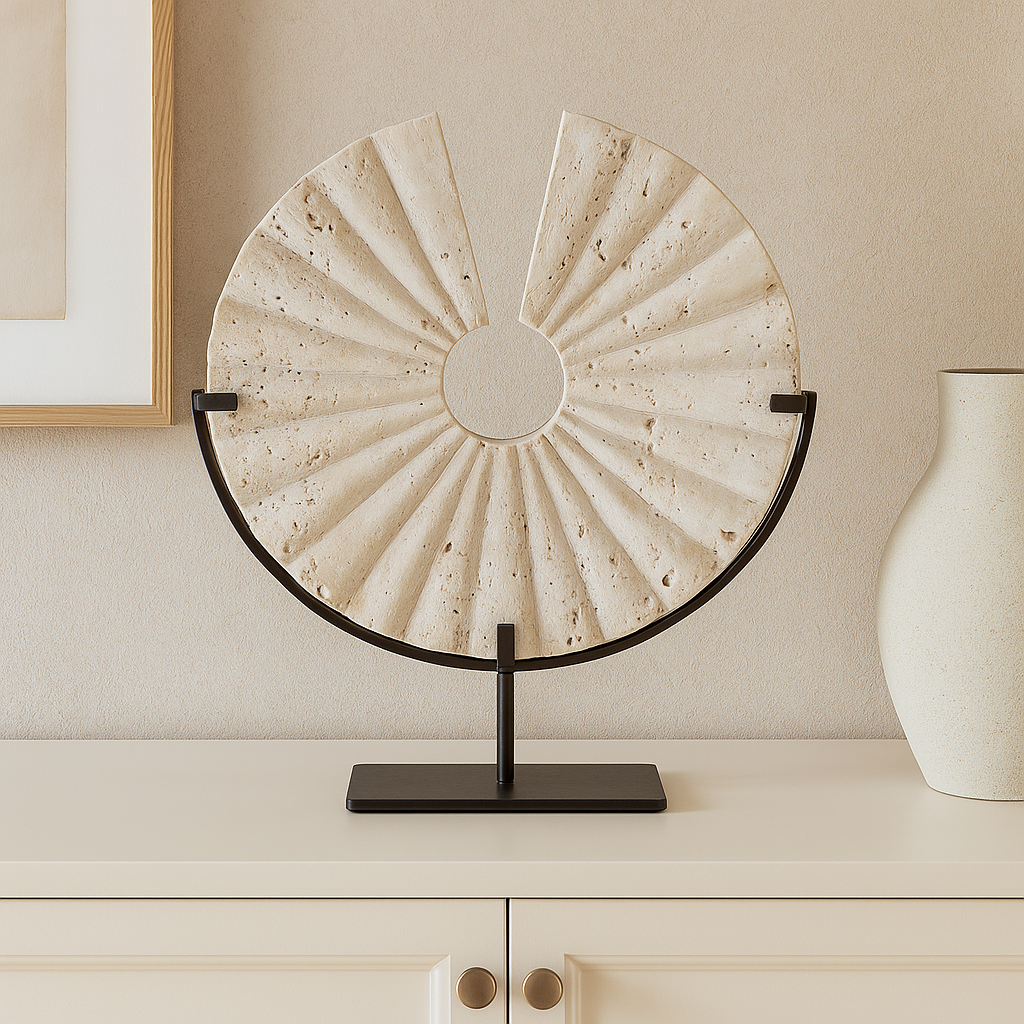 Travertine fan sculpture on cream sideboard in Scandi living room
