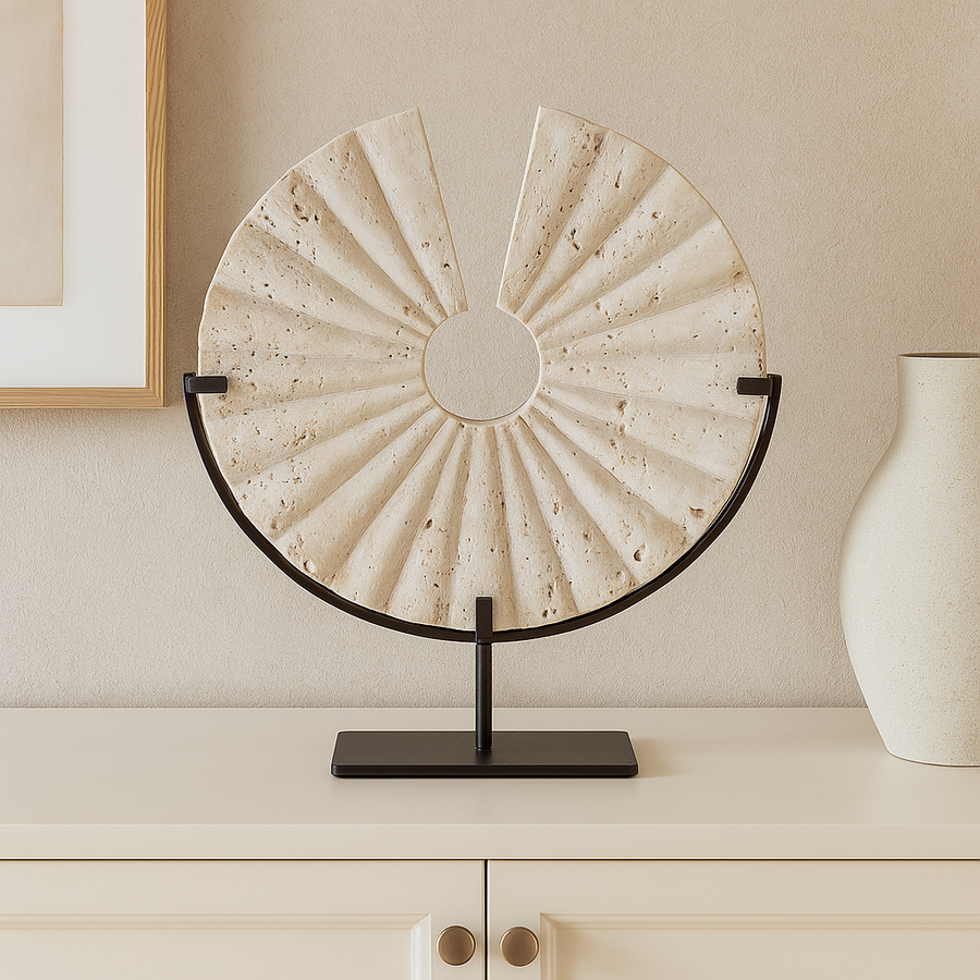 Travertine fan sculpture on cream sideboard in Scandi living room