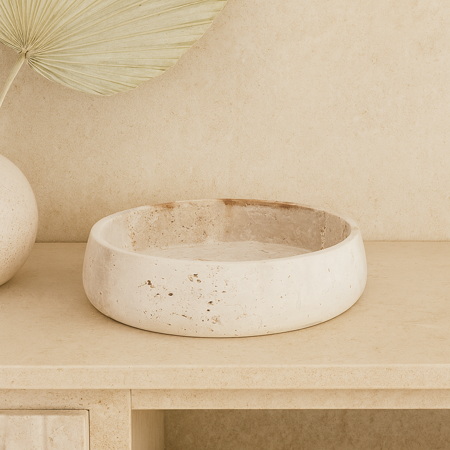 Luxury travertine stone bowl, 30cm wide, styled on a neutral sideboard with minimalist décor.