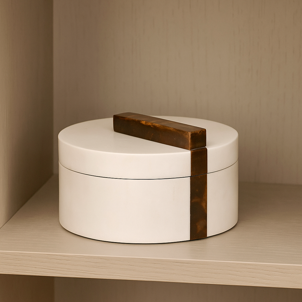 Luxury white round trinket box with brown marble effect handle styled on modern shelf