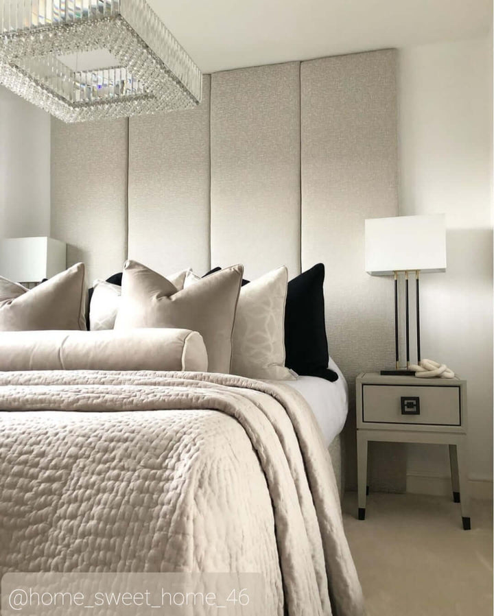 Close-up of Salzburg large square chandelier crystal glass and chrome frame, glowing softly in a luxury bedroom.
