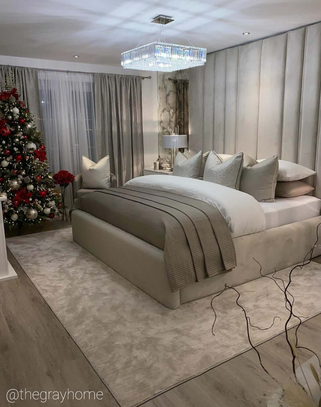 Side angle of Salzburg large square chandelier in a modern bedroom with chrome and crystal detailing.