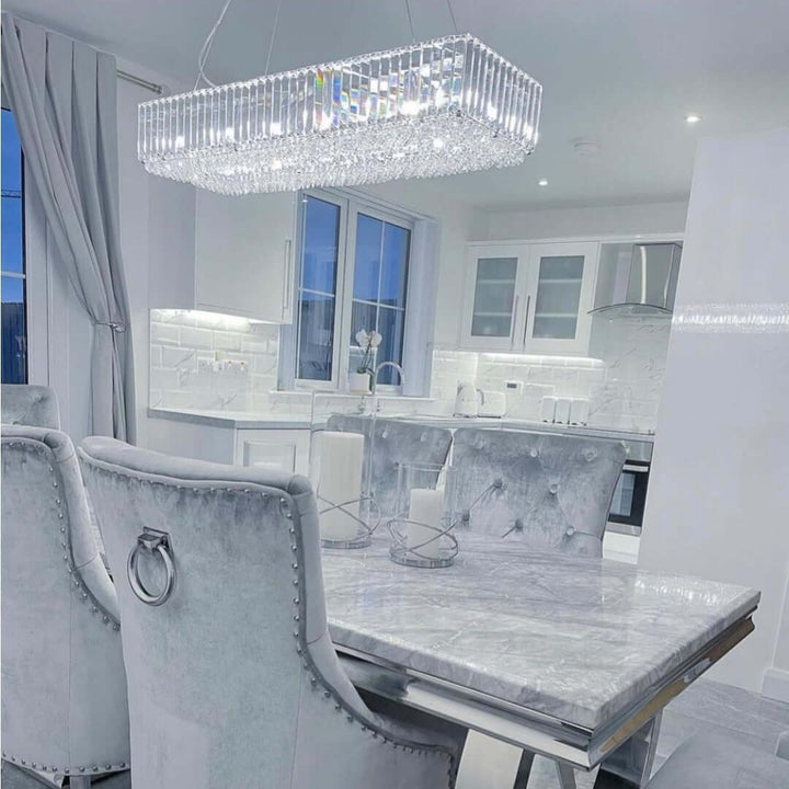 Salzburg rectangular pendant bar chandelier in polished chrome with crystal glass, styled in a luxury modern interior.