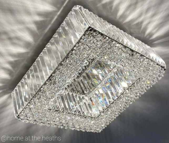 Close-up of Salzburg small square flush chandelier showing crystal glass blocks and buttons on polished chrome frame.